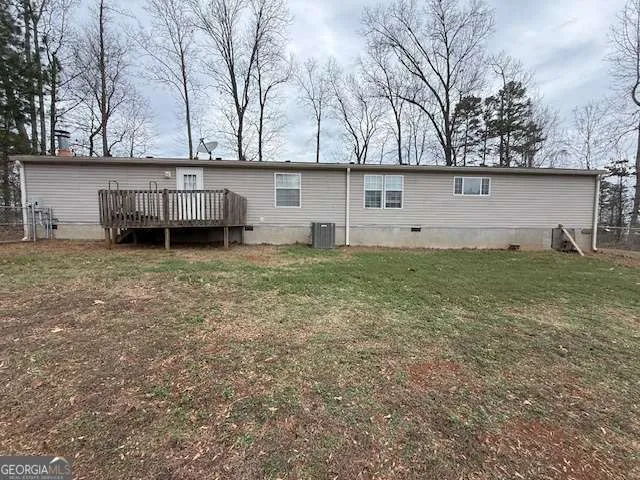 a house that has a tree in front of it