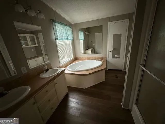 a bathroom with a double vanity sink toilet mirror and window