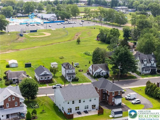a view of swimming pool outdoor seating and lake view