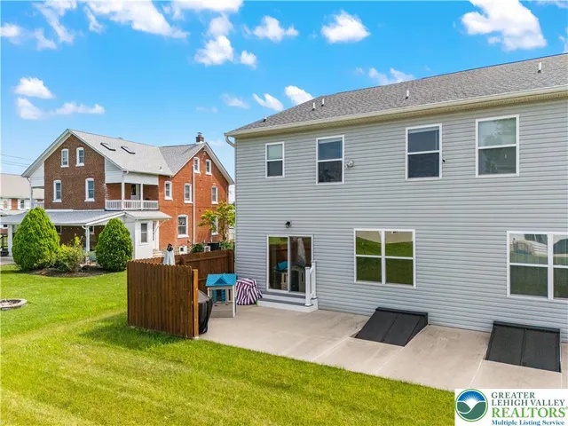 a backyard of a house with seating space