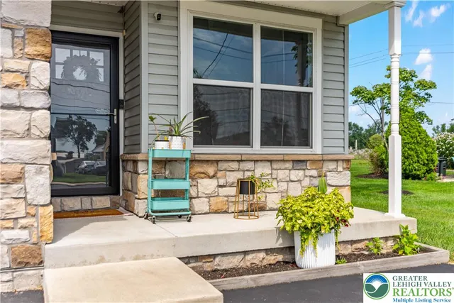 front view of a house with a potted plant