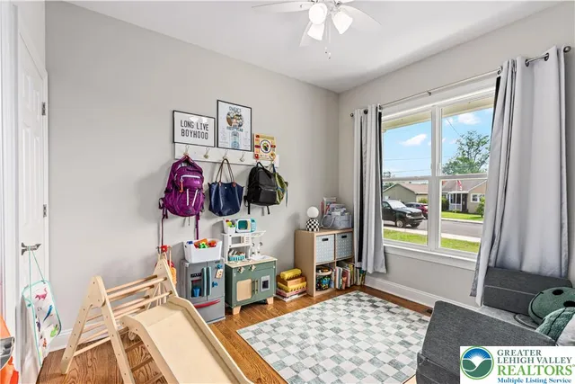 a bedroom with furniture and a window