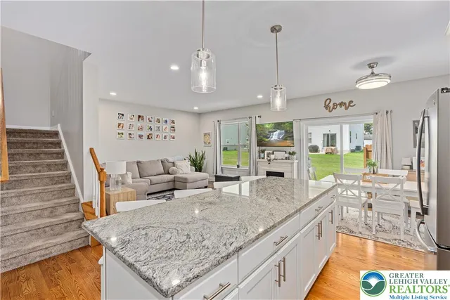 a view of a living room and dining room