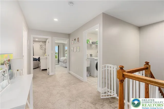 a view of a hallway with a livingroom and entryway
