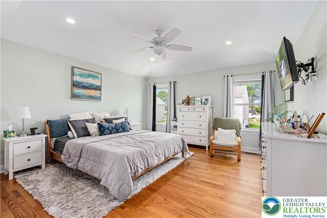 a bedroom with bed and window