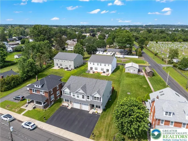 an aerial view of a house with a garden