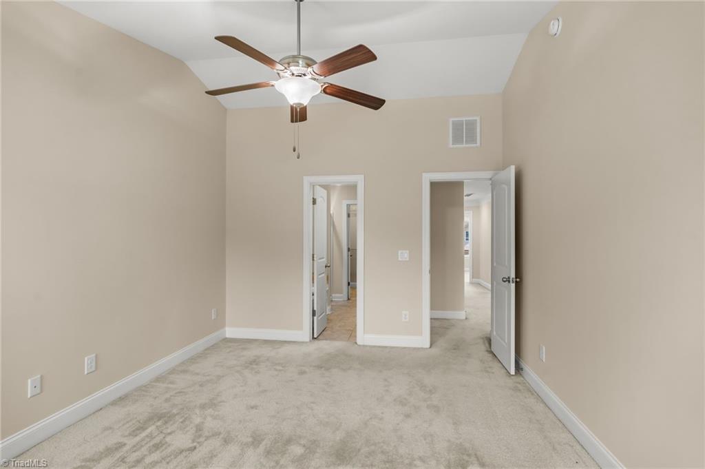 633 Stags Leap Court High Point, NC 27265 - Photo 19 of 40 Primary bedroom w cathedral ceilings