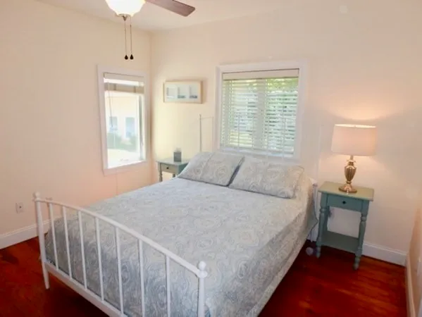 a bed room with a bed and a window