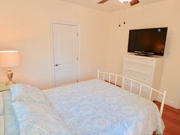 5 Laurel Avenue Oak Bluffs, MA 02557 - Photo 13 of 25 a bedroom with a flat screen tv and a bed