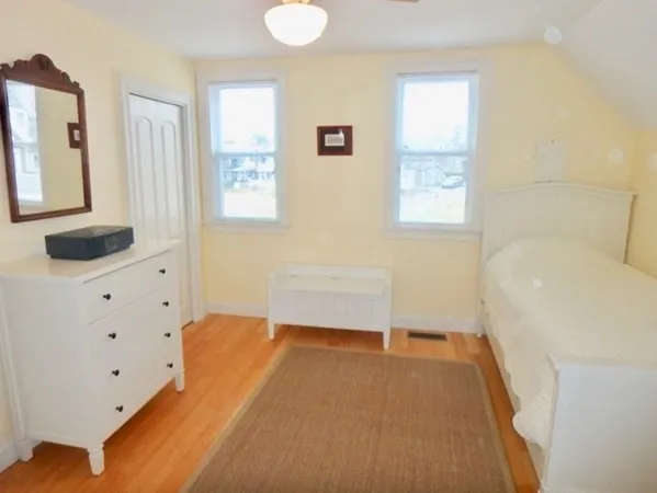 a bedroom with a bed and a cabinets