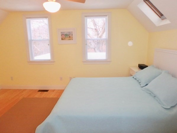 5 Laurel Avenue Oak Bluffs, MA 02557 - Photo 10 of 25 a bedroom with a bed and a window