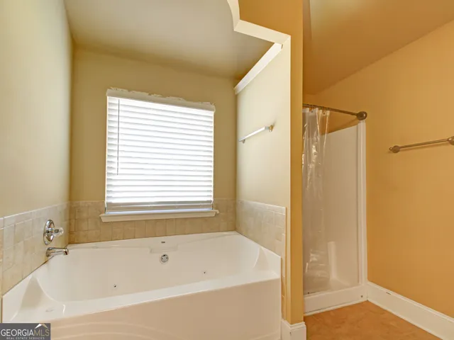a white bath tub sitting next to a window