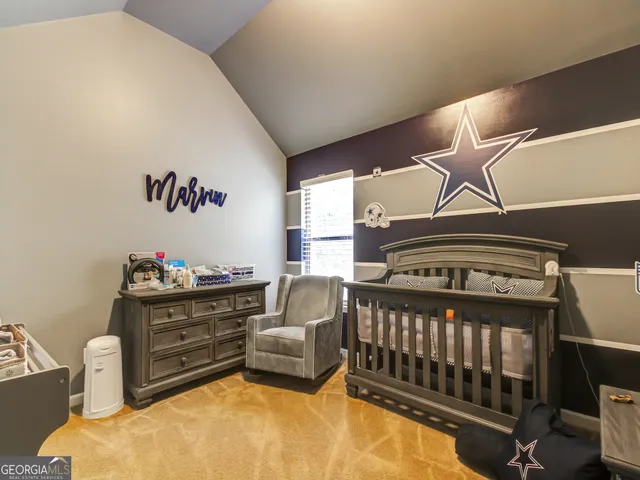 a bedroom with furniture and a window