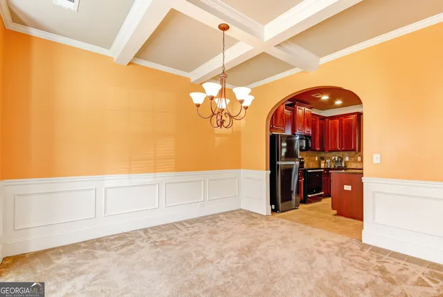 a view of a kitchen with a sink and cabinets
