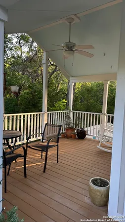 a view of balcony with wooden floor and outdoor seating