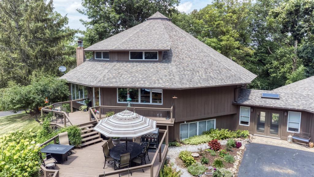 3205 West Southmor Road Morris, IL 60450 - Photo 11 of 74 a view of a house with a yard potted plants and a table