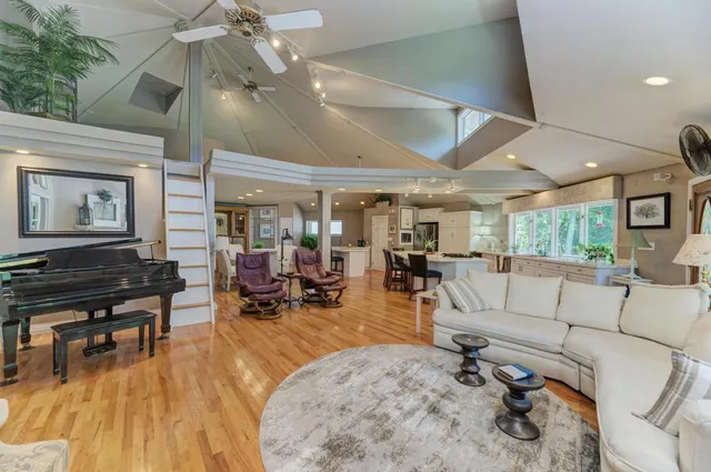 a large white kitchen with a large window