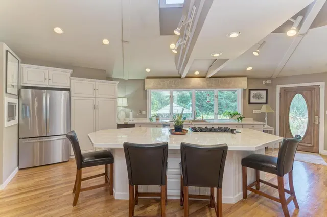 a view of a dining room with furniture and wooden floor