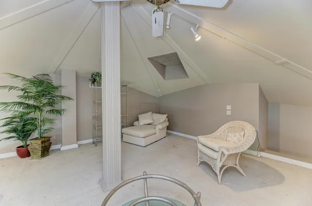 a white toilet sitting next to a shower curtain