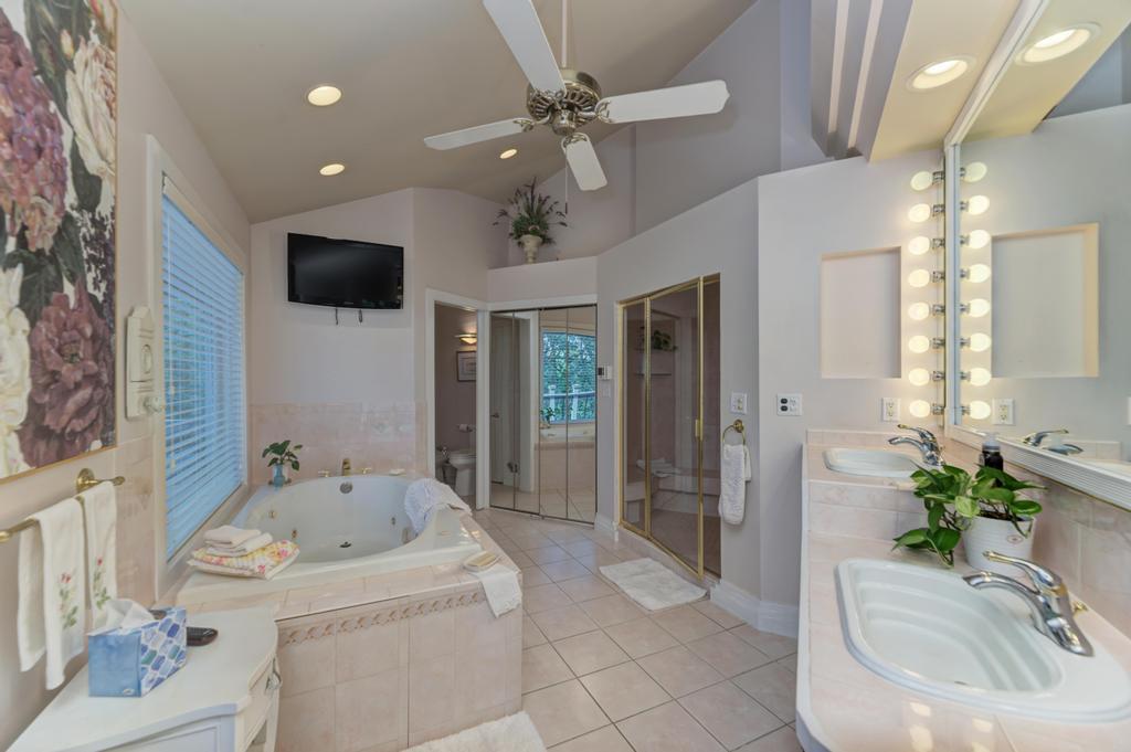 3205 West Southmor Road Morris, IL 60450 - Photo 35 of 74 a bathroom with a sink a large mirror and a shower