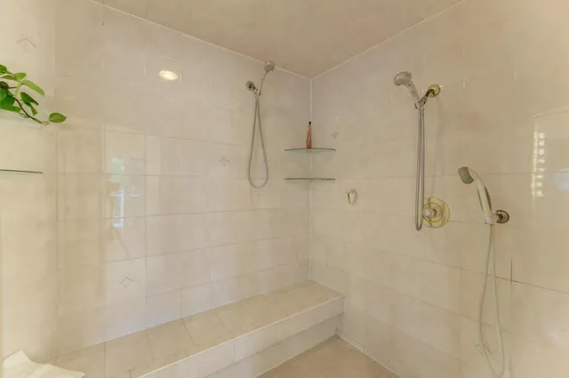 a kitchen with stainless steel appliances granite countertop a lot of counter space and wooden floor