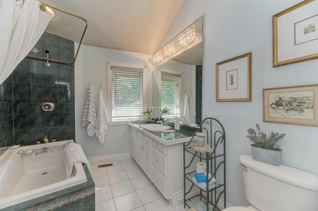 3205 West Southmor Road Morris, IL 60450 - Photo 42 of 74 a bathroom with a tub sink and mirror