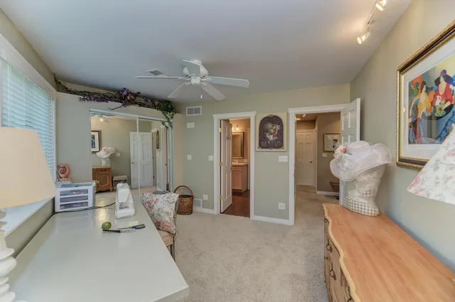 a backyard of a house with a yard and outdoor seating