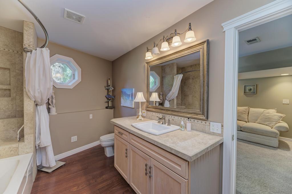 3205 West Southmor Road Morris, IL 60450 - Photo 49 of 74 a bathroom with a sink a toilet and a mirror