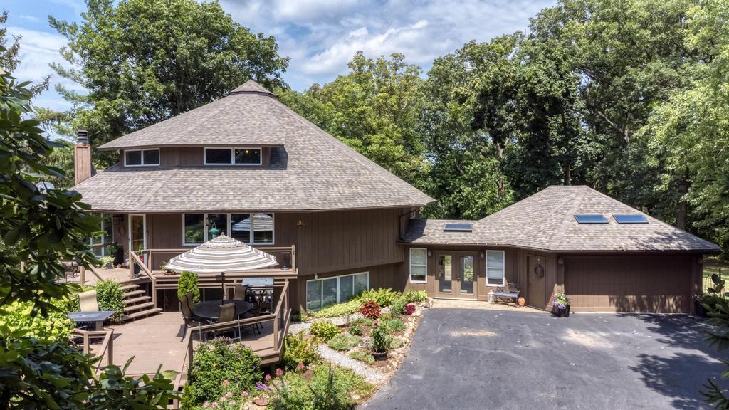 3205 West Southmor Road Morris, IL 60450 - Photo 10 of 74 an aerial view of a house with table and chairs under an umbrella