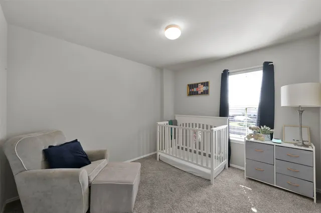 a bed room with a bed and a couch