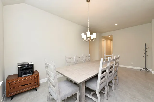 a view of a dining room with furniture and window