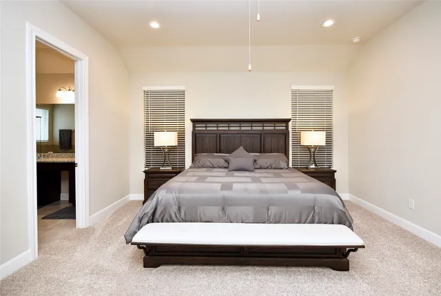 a bedroom with a bed and ceiling fan