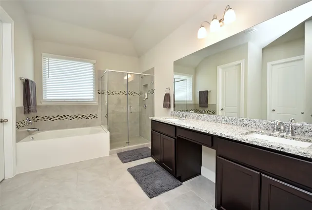 a bedroom with a bed and a ceiling fan