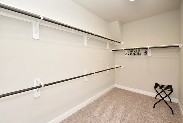 a bathroom with a tub a sink and a large mirror