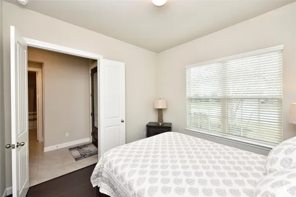 a view of small space with racks on the wall and a window