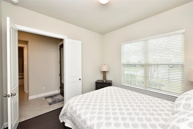 a view of small space with racks on the wall and a window