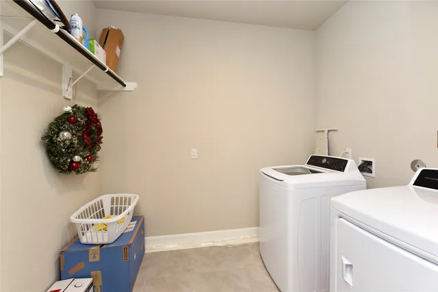 a view of storage and utility room with racks on the wall