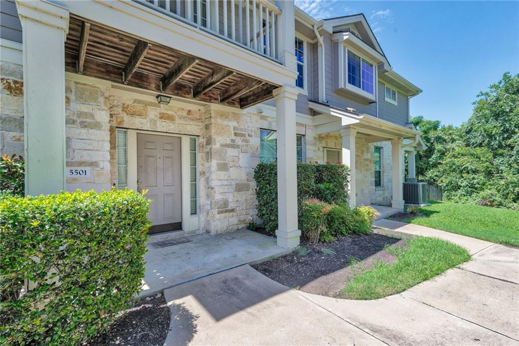 1900 Scofield Ridge Parkway, Unit 5501 Austin, TX 78727 - Photo 1 of 21 A welcoming stone facade and manicured shrubbery greet you, leading to a charming covered entry.