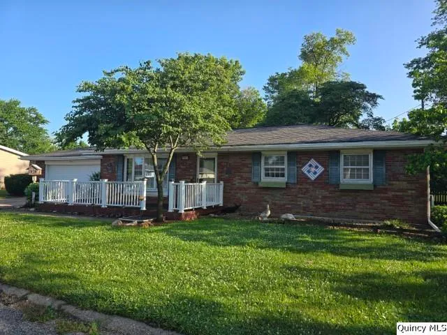 a view of a house with a small yard