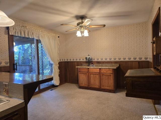 707 Country Lane Carthage, IL 62321 - Photo 4 of 26 a kitchen with a chandelier appliances and a counter top space