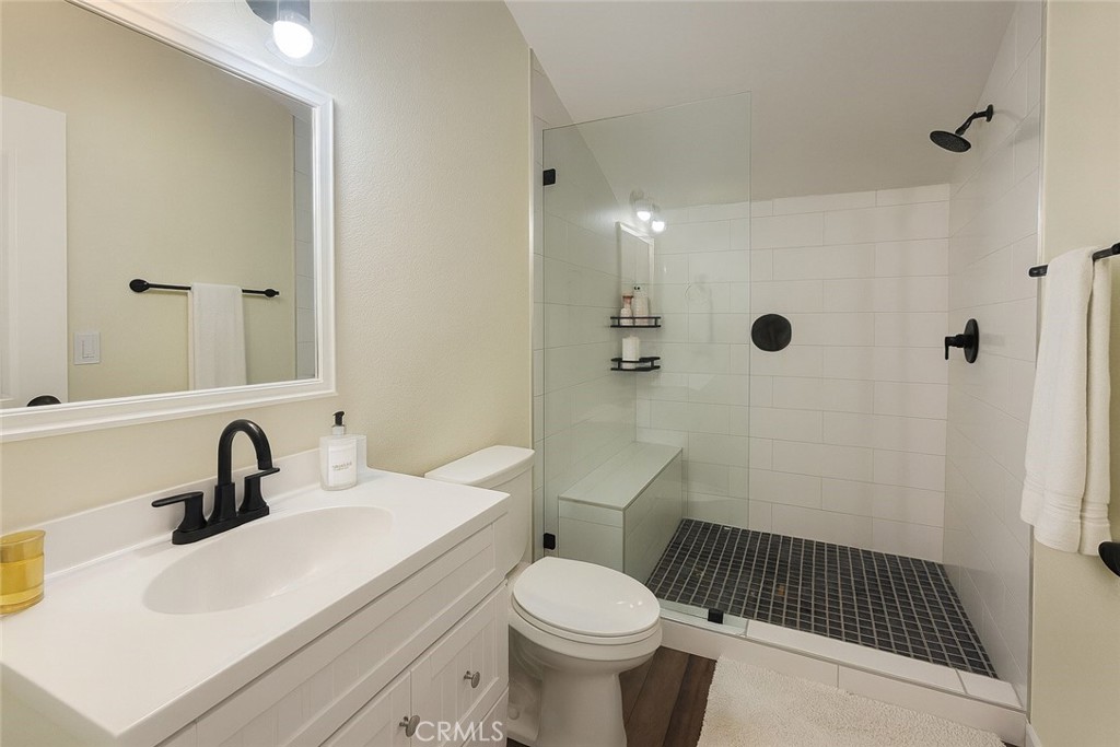 2323 South Cutty Way Anaheim, CA 92802 - Photo 12 of 26 a bathroom with a sink toilet and shower