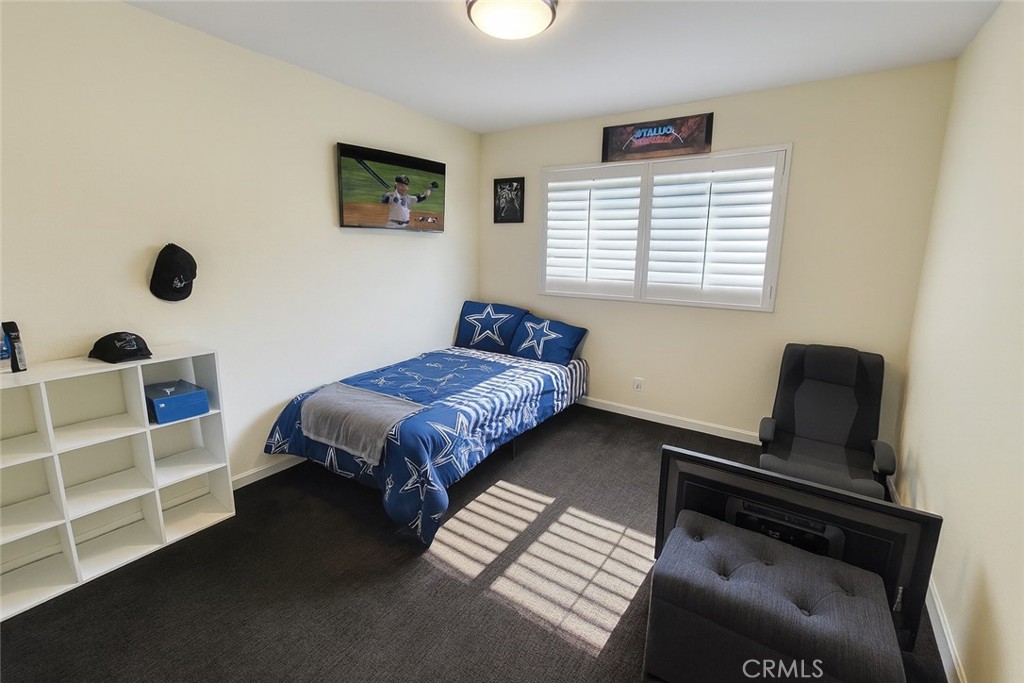 2323 South Cutty Way Anaheim, CA 92802 - Photo 16 of 26 a bedroom with a bed and a window