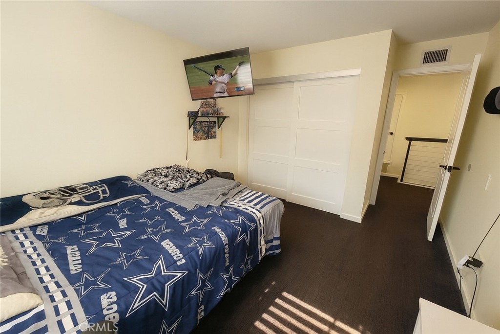 2323 South Cutty Way Anaheim, CA 92802 - Photo 19 of 26 a bedroom with a bed and a dresser