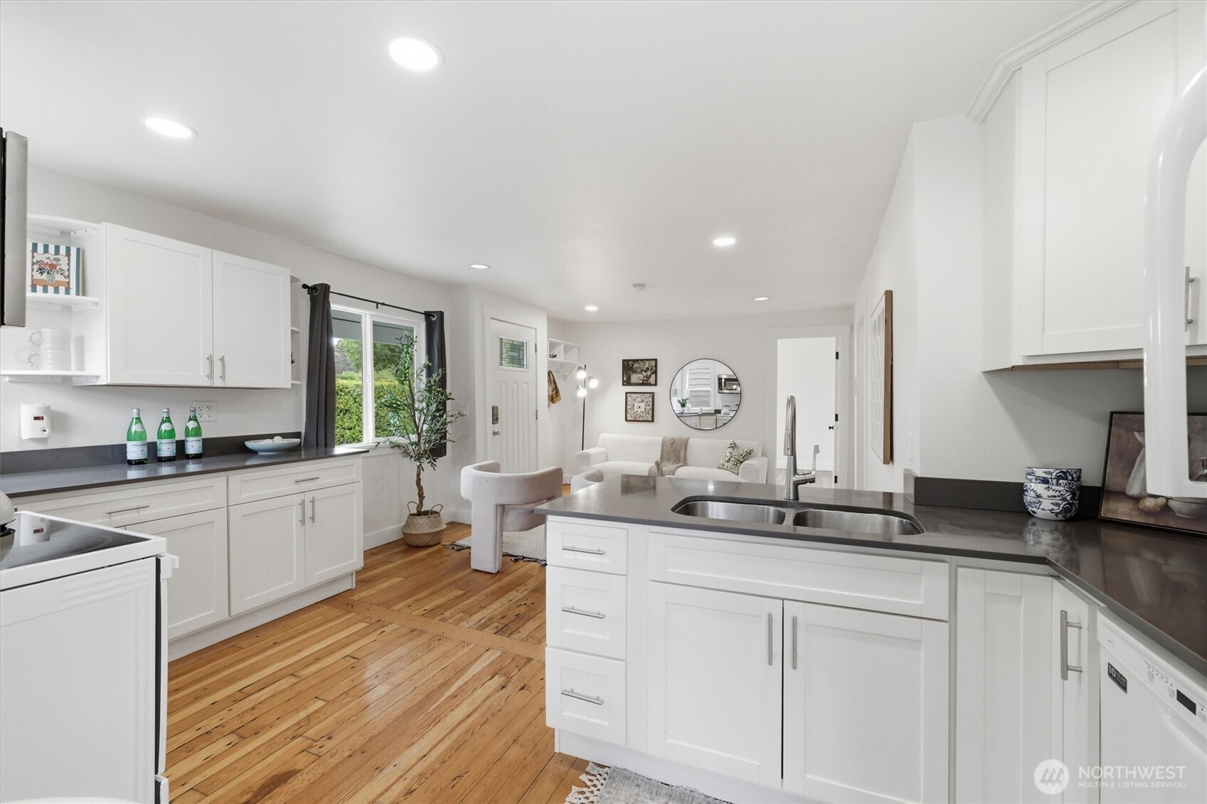 1651 Southwest 114th Street Seattle, WA 98146 - Photo 15 of 37 a large white kitchen with sink and white cabinets