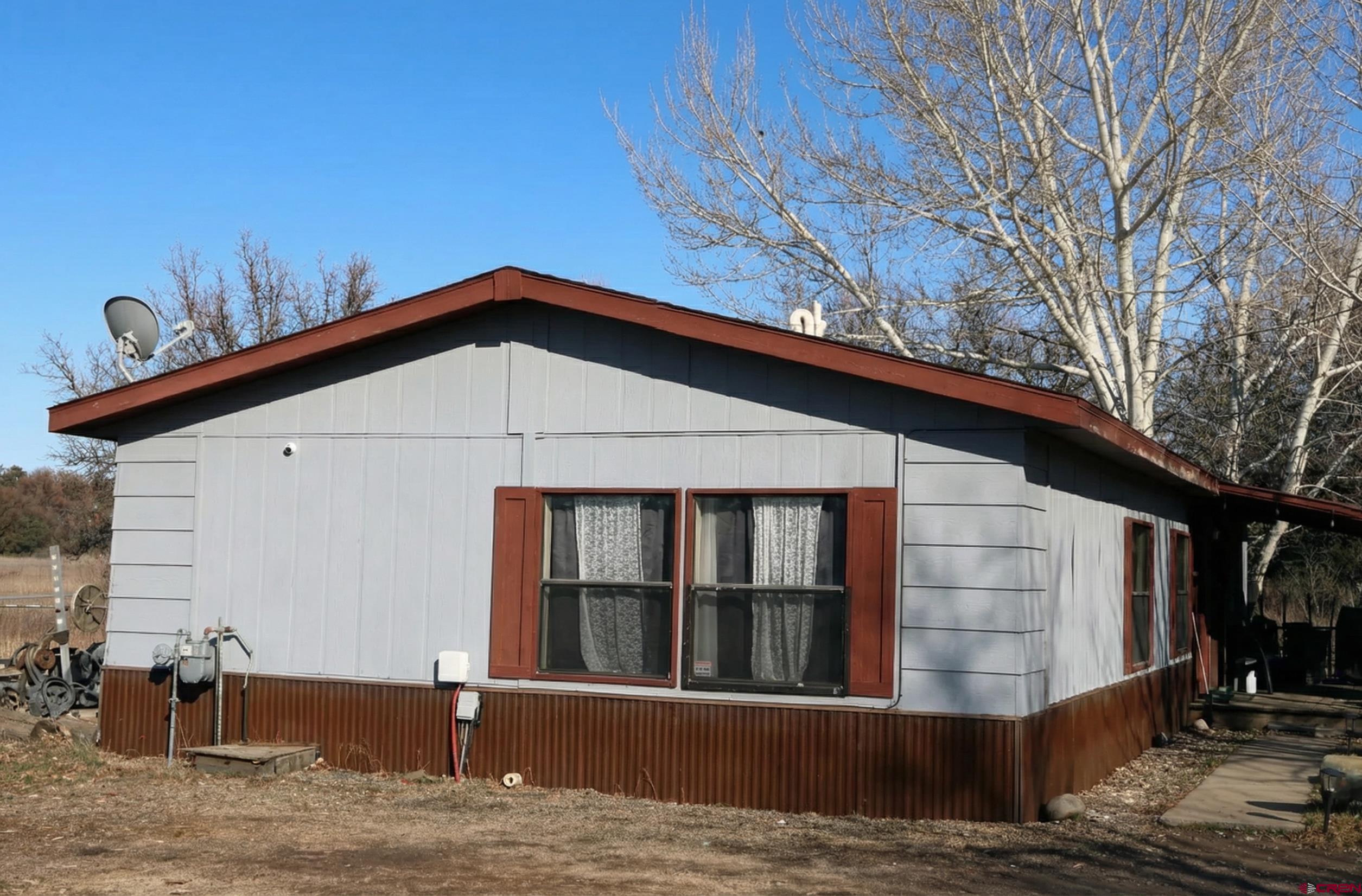28753 Highway 160 Durango, CO 81301 - Photo 21 of 21 a front view of a house with a garden
