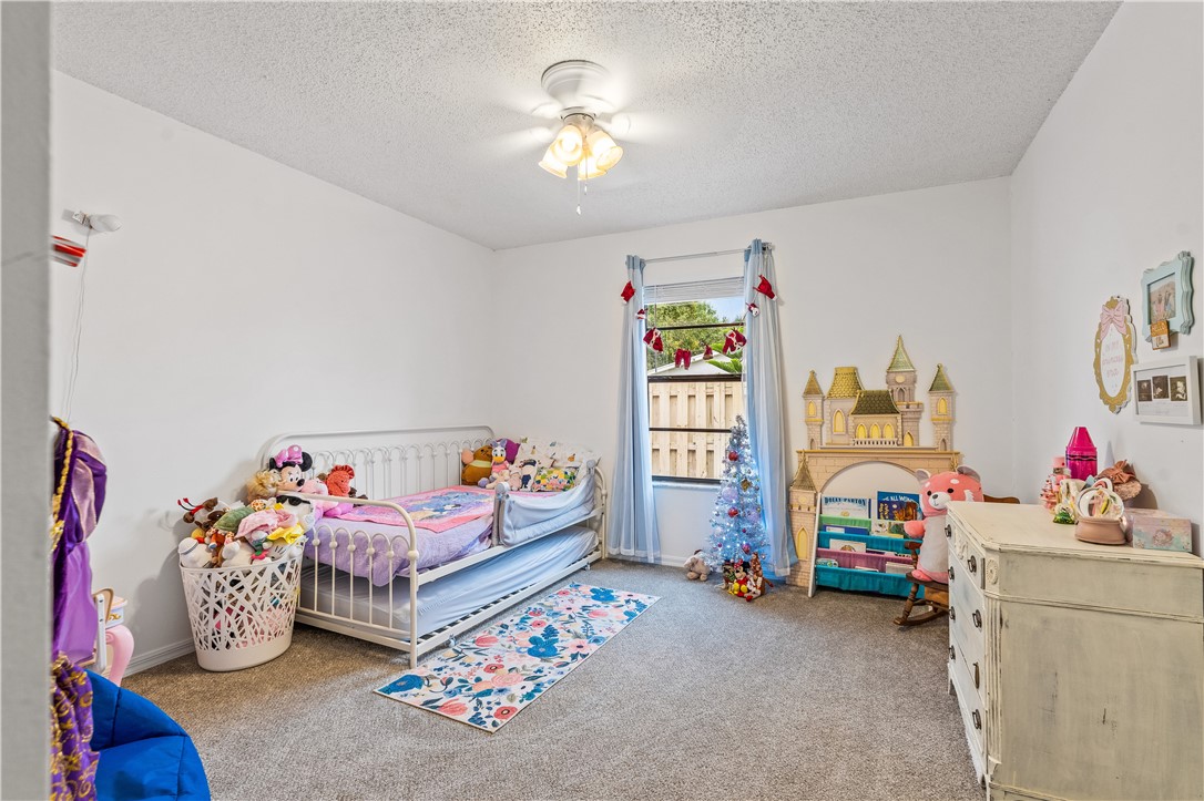 1092 Topsail Lane Sebastian, FL 32958 - Photo 24 of 36 a children room with toys and a couch