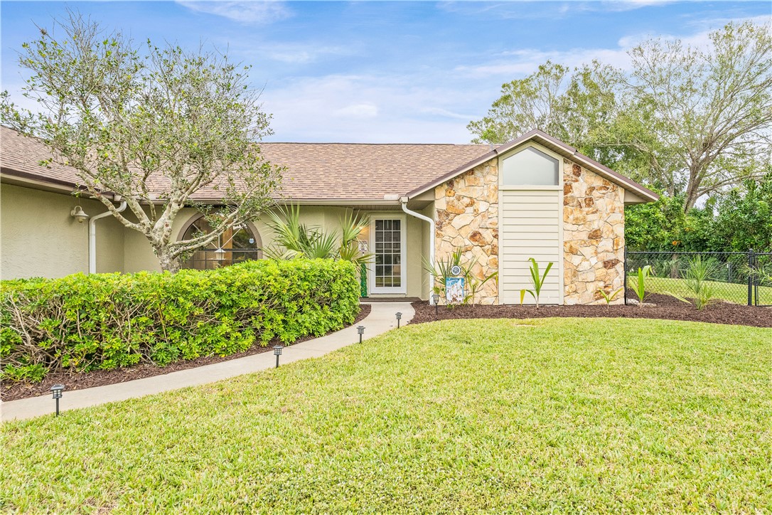 1092 Topsail Lane Sebastian, FL 32958 - Photo 35 of 36 a view of a house with a yard and a garden