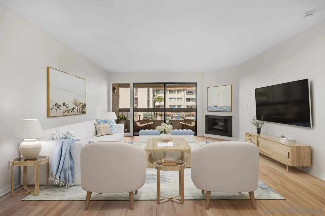 a living room with fireplace furniture and a flat screen tv