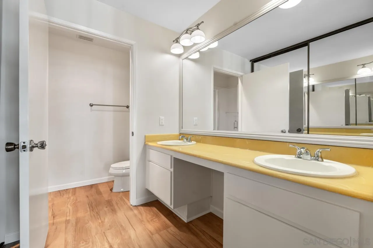 6747 Friars Road, Unit 110 San Diego, CA 92108 - Photo 11 of 24 a bathroom with a sink and a mirror