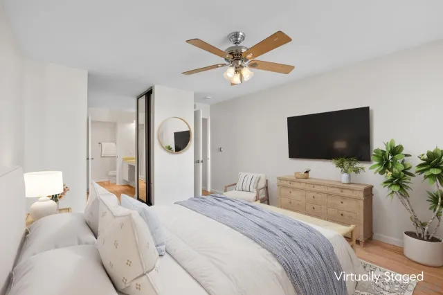 a view of a bathroom with a tub a sink and a mirror